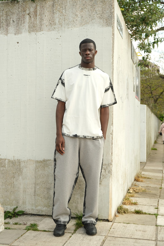 White short-sleeve T-shirt with black spray-painted border