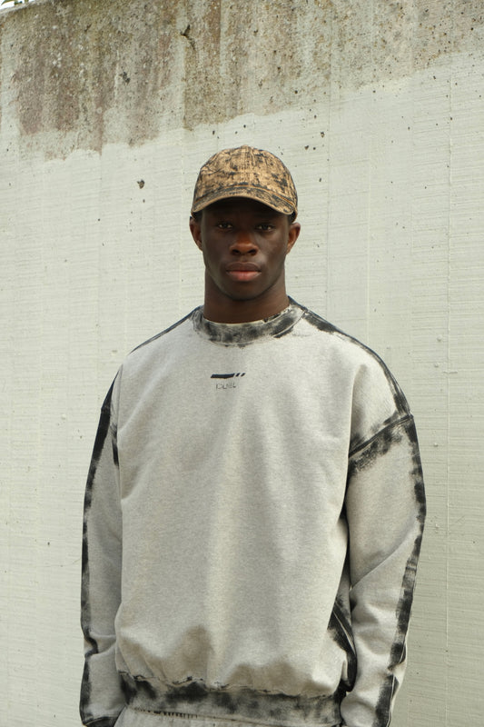 Beige and black carbon layered hat with textured hand-painted finish